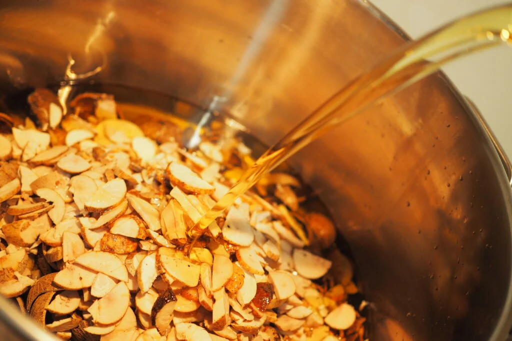 A bowl of processed Kulim fruits and our base oil ready to be infused.